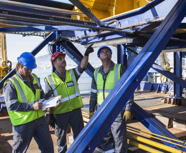 Crew onboard a ship inspecting with clipboard